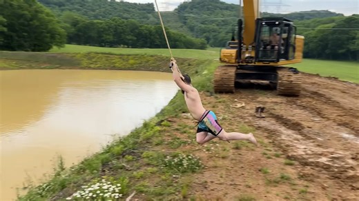 Watch what happens when a man is swung by an excavator