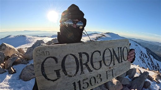 Holding the San G Sign in Mount Washington Wind