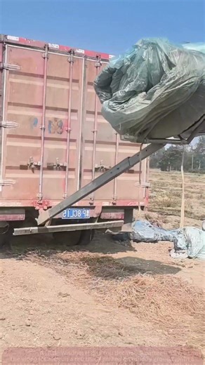 Heavy Cargo Transport Scene: Full Process of Loading a Large Package onto a Truck's Rear