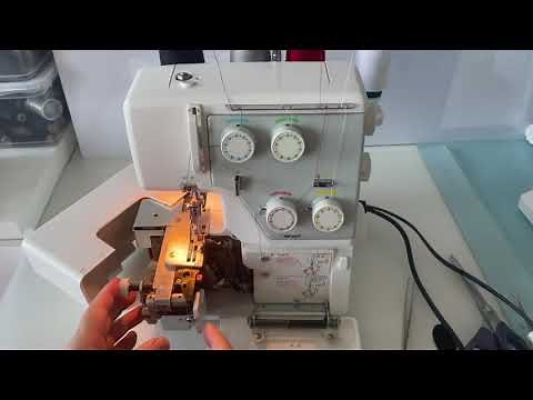 Threading Pfaff Hobbylock 4752 Switch off the knife and move the stitch width tongue