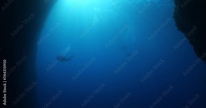 sun rays sun beams and sun shine underwater in cave beautiful light scenery in ocean scuba divers to see in cave backgrounds