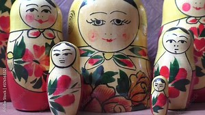 Matryoshka - Russian folding doll made of wood, inside which there are dolls of smaller size. Semenovskaya matryoshka is painted bright, with black hair, a handkerchief on her head. Retro