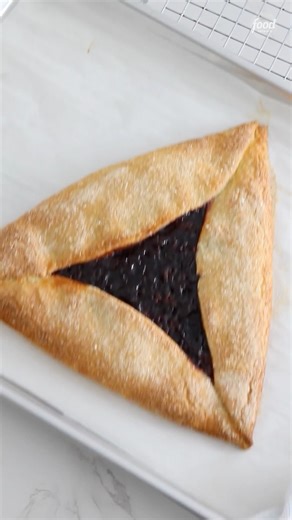ONE big Hamantaschen to rule them all ✨ Get Kim Klatzkin's Cherry-Frangipane Hamantaschen Galette recipe for Purim: https://foodtv.com/4kV0zt3 | Food Network