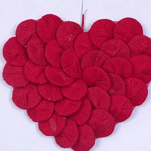 1.1K views · 94 reactions | Beautiful Heart Shaped Wall Decor Showpiece || Wall Hanging Making Using Woolen || Home Decoration #wallhanging #diy #heartframe | Hetal's Heart | Facebook