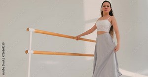 talented woman with raised arms, perorming at studio, girl has dancing lesson, standing tip toe, lifetsyle, freespare time hobby slow motion