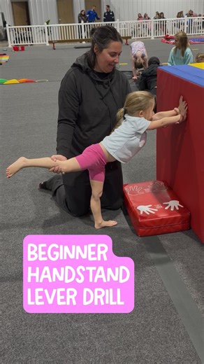 The Tumble Hub on Instagram: "Beginner handstand drill 🤸‍♀️ This lever entry handstand drill helps beginners build handstand strength, balance, body control, and proper technique. Starting in a lunge, athletes move into a T position, lever the back leg, reach to the wall or mat, place hands on the floor, then press back up with control. Perfect for beginner gymnastics, tumbling basics, handstand progression, and foundation skill development. Strong basics create confident athletes 💪"