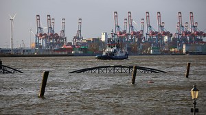 A powerful storm swept across northern Europe, bringing down trees and prompting warnings of flooding.