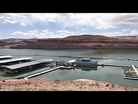 Halls Crossing taken over Marina in parking area. Lake Powell water April conditions access.