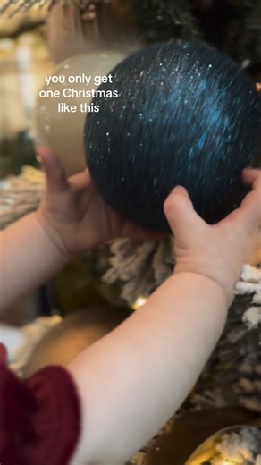 JESSICA SIMPSON | 📍Realtor in Columbia, Missouri on Instagram: "I imagine there will be a tree on the ground and a handful of broken ornaments at the second Christmas. 🎄👼 #merrychristmas #firstchristmas #babysfirstchristmas"