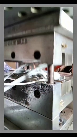 Real Engineerings | Engineering & Technology & Gadgets & DIY on Instagram: "Mass Production Magic: The Art of Insert Molding! 🔌🏭 ​Ever wondered how the plug at the end of your charger is made? It isn't glued together; it is fused into one solid piece using a specialized process called Insert Molding. This video gives us a behind-the-scenes look at how raw cables become finished products! ​The Engineering Behind the Process ​This isn't your standard injection molding; this is a Vertical Injecti