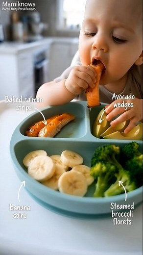 Real food. Happy baby. Zero stress. 🥑✨ This is baby-led weaning in its sweetest, simplest form 💛 (Salmon, avocado, broccoli & banana—perfect for tiny hands!) 👉 Save this for your next easy, wholesome meal! #BLWmadeeasy There’s something so special about watching your baby discover real, whole foods on their own terms ✨ In this quick clip, you’ll see a balanced, nutrient-dense baby-led weaning meal that’s soft, safe, and full of flavor: ✅ Baked salmon (rich in omega-3s!) ✅ Creamy avocado wedge