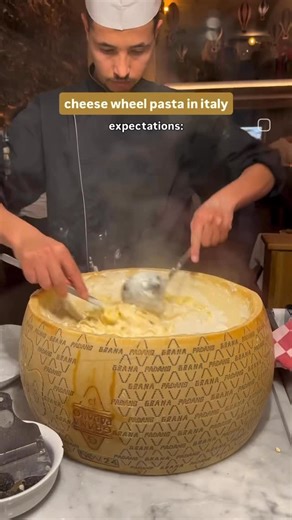 Mel • Hobart & Melbourne Foodie on Instagram: "Trying the cheese wheel pasta didn’t exactly go to plan while I was in Rome 😂😅 Cold spaghetti was used so the cheese wasn’t melting off the cheese wheel so our lovely waitress had to literally scrap cheese off wheel.. and add water 😂 What an experience lol, this was definitely not worth the €22 we paid for it but c’est la vie - jokes on us for falling for a tourist trap with (likely fake) google reviews #rome #italy #cheesewheelpasta #cheesepasta