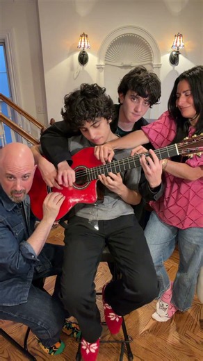 Family of 4 on 1 Guitar playing DESPACITO!