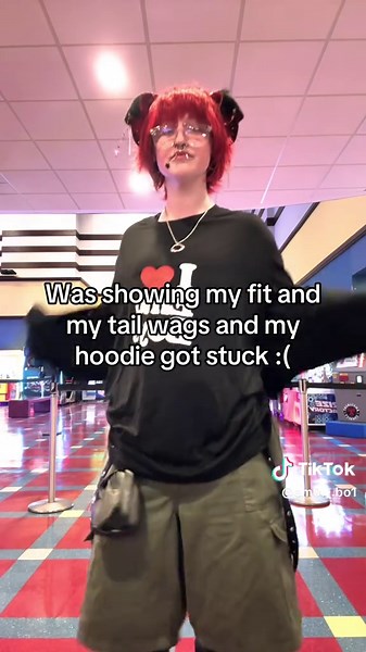 Dog Costume Mishap: Tail Wags and Hoodie Gets Stuck