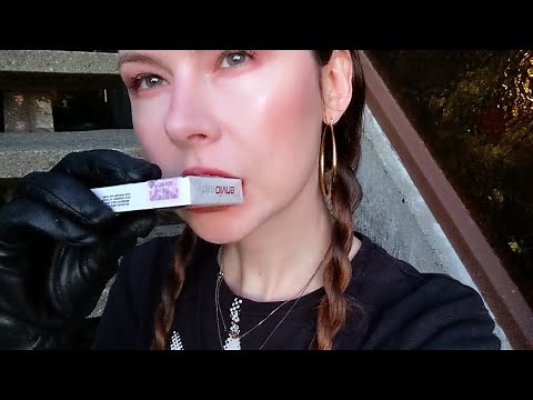 Smoking Envio Mild clove cigarettes in black leather gloves (review)