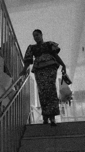 Stylish Staircase Descent in Vibrant Dress