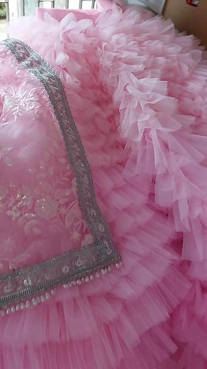 Sewing Process of Pink Fabric with Intricate Embroidery