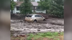 Watch car get swept away in AZ flash floods