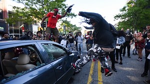 Lansing protest against police brutality escalates Sunday evening, leading to property damage, curfew