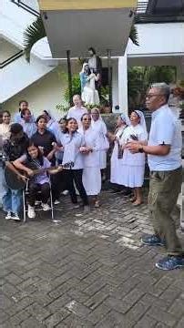 Indonesian Catholic Priest sing and dance with his parishioners on his 29th priestly Anniversary
