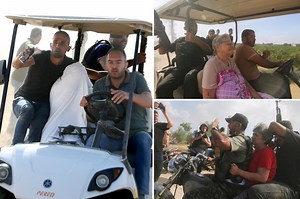 Hamas militants seen taking Israeli captives from settlement near Gaza