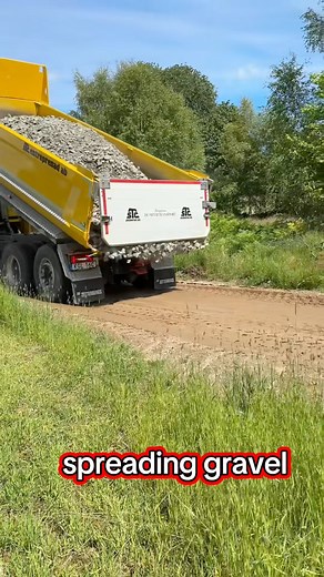Dump truck reverses, spreading gravel while compacting with tires, creating stable base without disturbing underlying soil. #DumpTruck #GravelWork #SoilCompaction #Backfilling #PavementPrep #ConstructionLife #SiteWork #HeavyEquipment #RockBase #EfficientBuilding | Kayala Domes