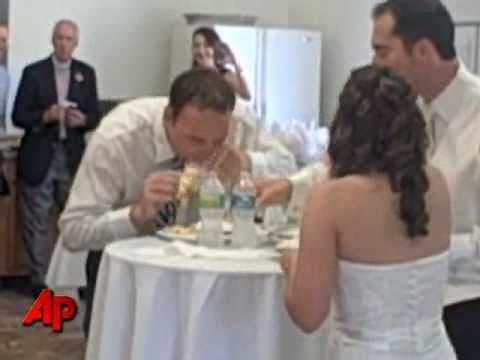 Raw Video: Groom, Bride Hold Cake Eating Contest