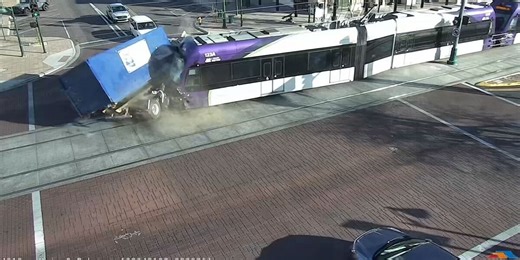 Video shows light rail train fail to stop at intersection, crash into garbage truck