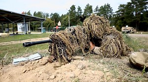 In response to a challenge by NATO in Poland, eFP Battle Group Poland Sniper, Spc. Scott Shaffer of the 278th Armored Cavalry Regiment shoots the cap off a water bottle at the Bemowo Piskie Training Area, Poland, Aug. 13. The Bottle Cap Challenge has officially taken over the Internet. The viral trend, where people unscrew a bottle cap with a 360-degree kick, has spread all over social media over the past couple of weeks. The challenge has taken on many forms, with some participants using everyt