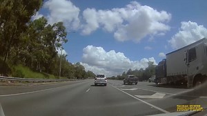 #WATCH: The heart-stopping moment a car and truck collided on the M1 at the #GoldCoast, after trying to merge into the same lane. While the Toyota spun out onto the side of the highway in a smoky haze, the freight truck continued steaming ahead. #9GoldCoastNews | Nightly at 5.30pm | 9 News Gold Coast