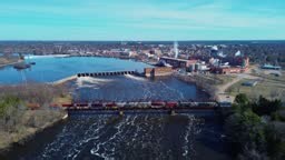 Aerial video of the Wisconsin River in Stevens Point, Wisconsin on a...