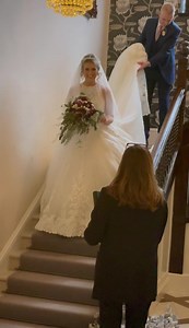 Making a stunning and very grand entrance beautiful Alice carrying a magnificent bouquet of plum Peonies, Garden Roses & Jasmine and her proud Dad over at beautiful @bartlehallhotel gorgeous gown by @ameliasbridal | Flower Design