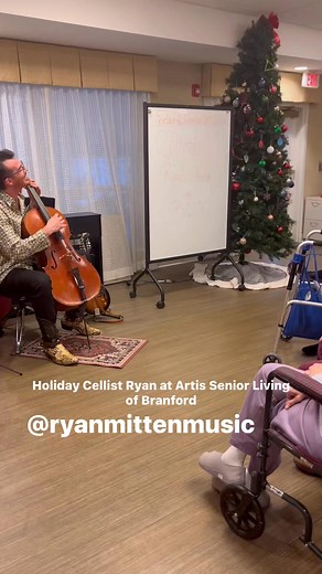 Ryan Mitten Music came to Artis to play for us and we all had a great time! Just another way we thrive to provide the best programming for the best memory care. #memorycare #TheArtisWay #cellist #holiday #alltogether | Artis Senior Living of Branford