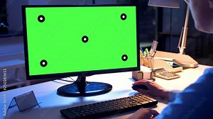 technology, virtual effects and business concept - businesswoman working on computer with chroma key green screen at night office