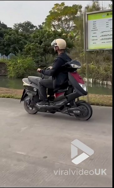 VV4910 Man riding a reverse-assembled motorcycle
