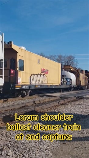 Loram shoulder ballast cleaner train at end capture: