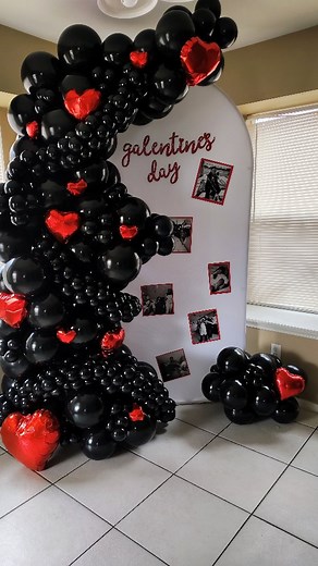 Happy Galentines Day to all of my balloon gal and guy pals. ♥️ Classic black organic balloon garland with red foil heart accents on a Chiara stand. #tairasballoonco #pflugervilleballoons #balloongarlands #galentinesdecor | Antaira Gueperoux