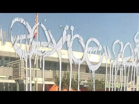 Removing acid etch graffiti from glass