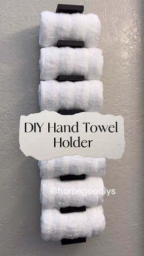 ✨DIY Hand Towel Holder✨ All supplies from Dollar Tree! 🌳 Helpful tips: ✨I used heavy duty double sided tape to hang this. You might also be able to use command strips, but I would suggest using quite a few to support the weight with towels. ✨I used 24 tumbling blocks total, evenly spaced apart. This fit the size of my towels, but you’ll want to use one of your hand towels to measure how much space is needed in between blocks. ✨The space should be smaller than the actual towel, so it’s a snug fi
