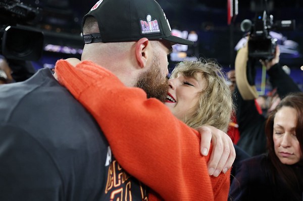 Travis Kelce Kisses Taylor Swift on the Field After He and Chiefs Clinch Spot in 2024 Super Bowl