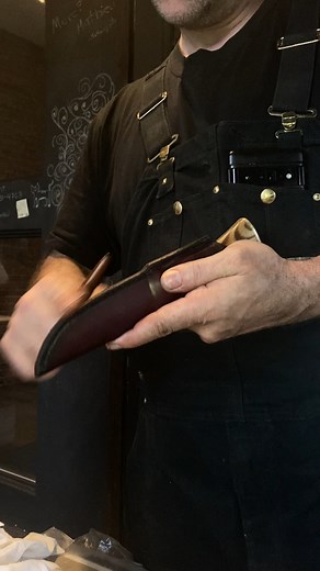 2.1K views · 18 reactions |  Fabrication de couteau  Tous nos couteaux et nos étuis sont fabriqués à la main (littéralement!) dans notre atelier ! Ici, vous pouvez voir Mathieu enseigner à Axel comment faire les finitions sur un étui en cuir. | Les Forges de Montreal | Facebook