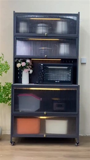 19K views · 14 reactions | This 5-tier storage cabinet with flip lids keeps all your grains, snacks, and essentials neatly organized & dust-free   Transparent design = easy to find what you need  Space-saving & stackable  Flip lids = quick access anytime Perfect for kitchen, pantry, or even your bedroom corner! ️  Tap link in bio to grab yours today! #KitchenStorage #OrganizedLiving #SpaceSaver #FlipLidCabinet | Smart Home Gadgets | Facebook