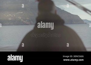 Captain steering wheel sailboat during floating past coast Cinque Terre Italy Stock Video Footage - Alamy
