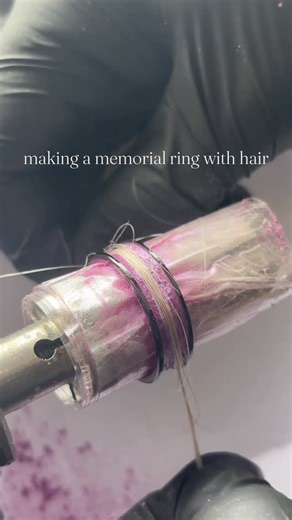 Rings By Blake on Instagram: "Making a special ring to remember someone loved💜 This is a black plated tungsten ring with a magenta/purple base and hair from a loved one on top. #rings #sentimentaljewelry #handmade"