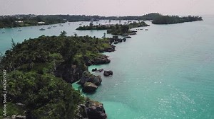 Bermuda drone shot of island archipelago with coastline, jungle and clear shallow water near Morgan's Island