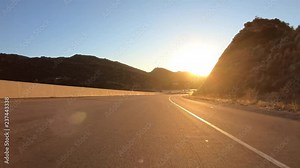 Los Angeles Santa Susana Pass sunset freeway ramp driving on the 118 Freeway west near Rocky Peak and Simi Valley. Stock Video