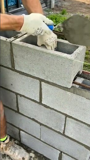 Building a house wall with concrete blocks,ensuring neat alignment strength, long lasting durability