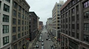 A vibrant view of the Washington Avenue Loft District, showcasing its historic architecture, trendy lofts, and lively atmosphere, capturing the essence of urban living and revitalization.