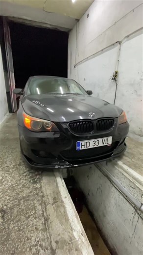 DIY BMW Headlight Tape Application in Garage Setting