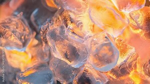Close-up shot captures the contrasting elements of ice and fire, with glowing flames enveloping transparent ice crystals. The image evokes a surreal and dynamic atmosphere, highlighting the interplay